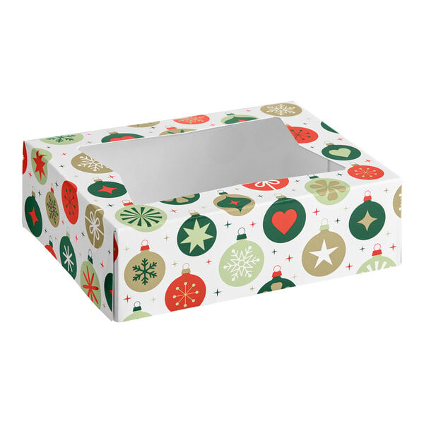 A rectangular box with a clear window on top, decorated with colorful Christmas ornament patterns in red, green, and gold.
