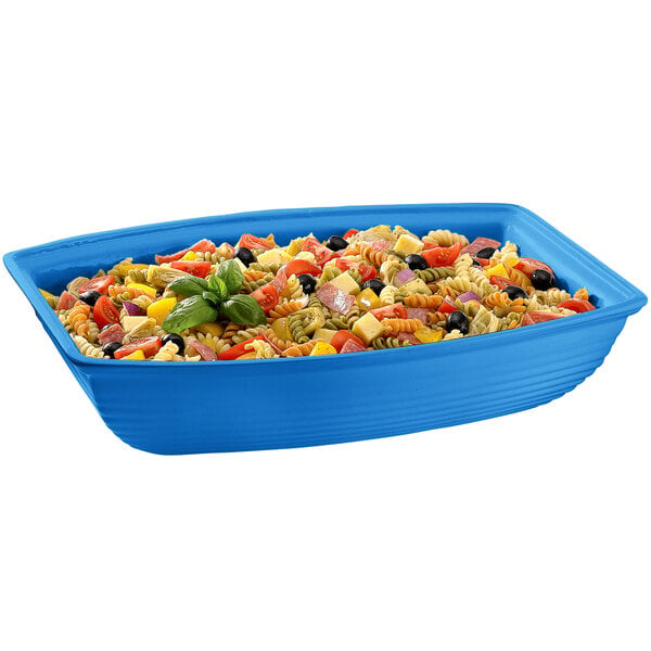 A sky blue rectangular cast aluminum container with salad.