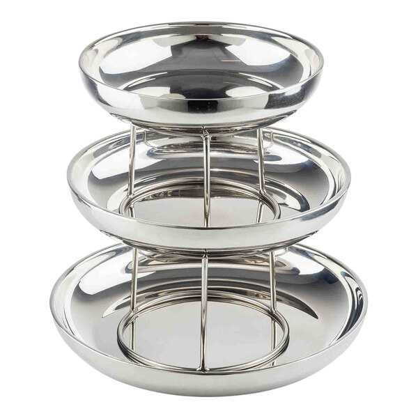 A three-tiered, round, double-walled stainless steel seafood tower.