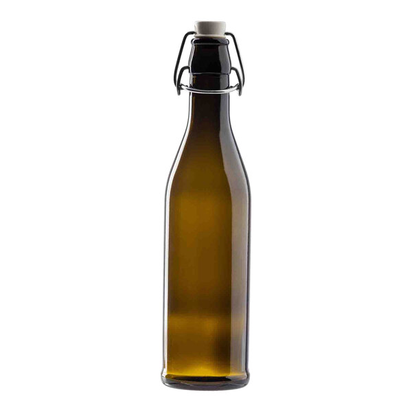 A dark green glass cruet with a stopper and metal clasp, designed for holding liquids.