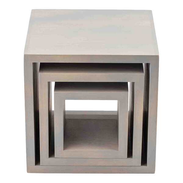 A set of three square gray wood risers nested together.