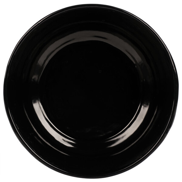 A black cast aluminum fruit bowl with a white background.