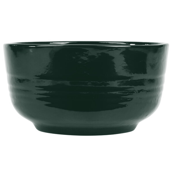 A dark green Tablecraft cast aluminum bowl with a black rim.