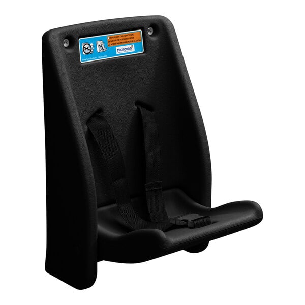 A black wall-mounted child safety seat with harness straps and an instructional label at the top.