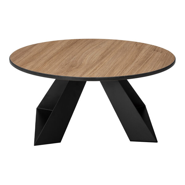 A round table with a natural wood-like top and black geometric legs.