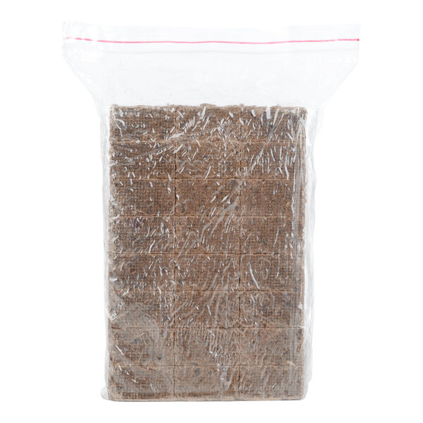 A clear plastic bag containing rectangular brown fire starter squares made from natural wood sawdust and wax.