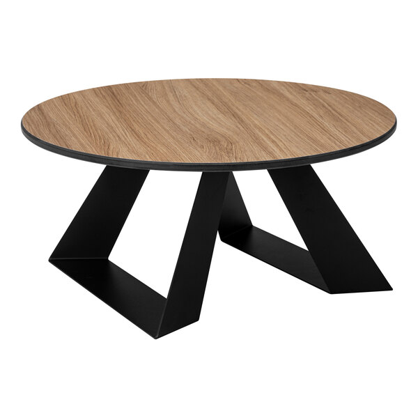 A round table with a natural wood-like top and black geometric metal legs.