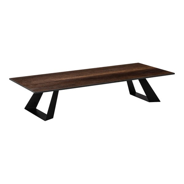 A rectangular riser with a dark wood-like top and two angled black metal legs.