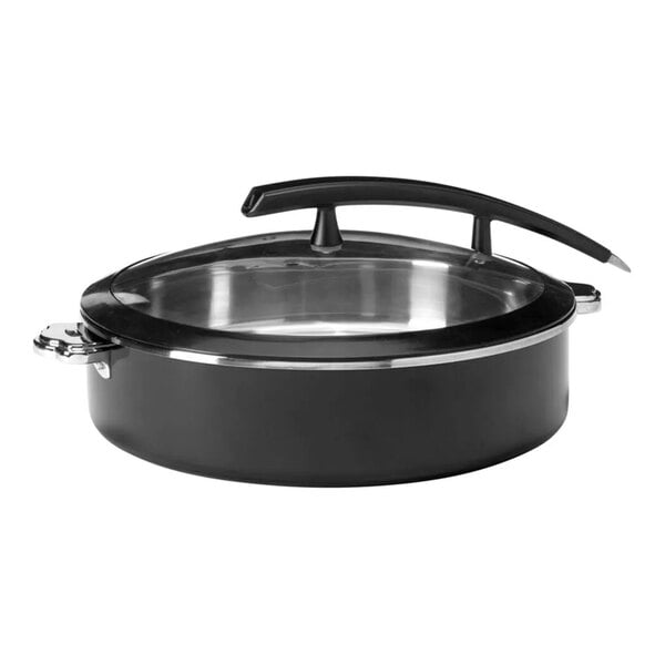 A round black steel buffet server with a glass lid and a large curved handle on top.