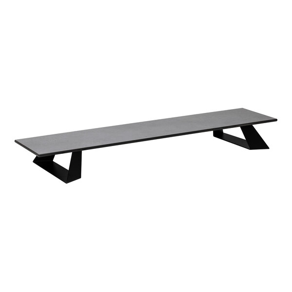 A rectangular, low-profile platform with a concrete gray surface and two angular black supports.
