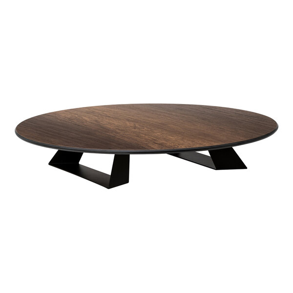 A low, round platform with a dark wood-like top and black angular supports.