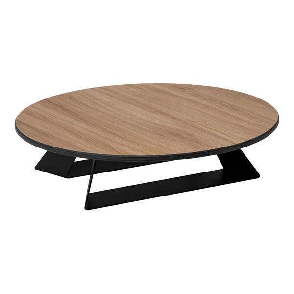 A round, low-profile riser with a natural wood-like top and a black geometric base.