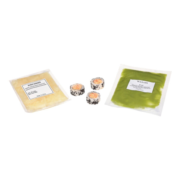 A package of Moji Sushi Spicy Crab Sushi Roll with sides of sushi ginger and wasabi.