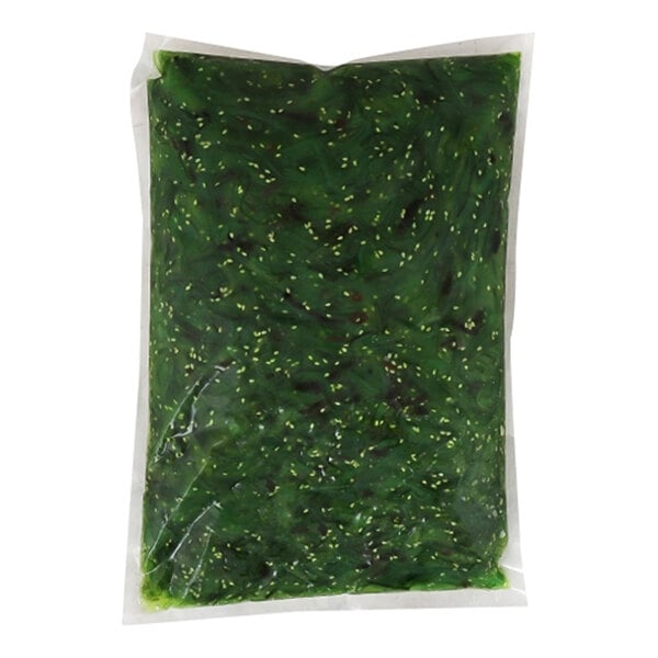 A vacuum-sealed bag of seaweed salad with visible sesame seeds.