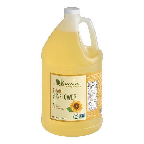 A large, clear plastic jug with a handle and white cap, filled with light yellow liquid and labeled as organic sunflower oil.