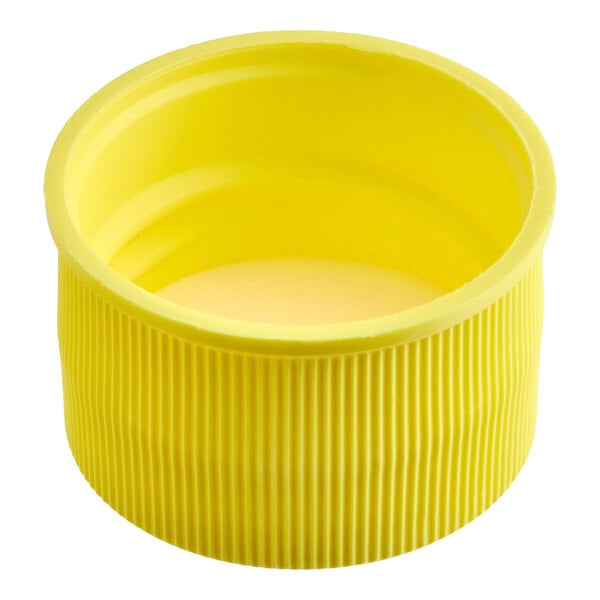 A yellow ribbed plastic cap with a smooth inner lining, shown from an angled top view.