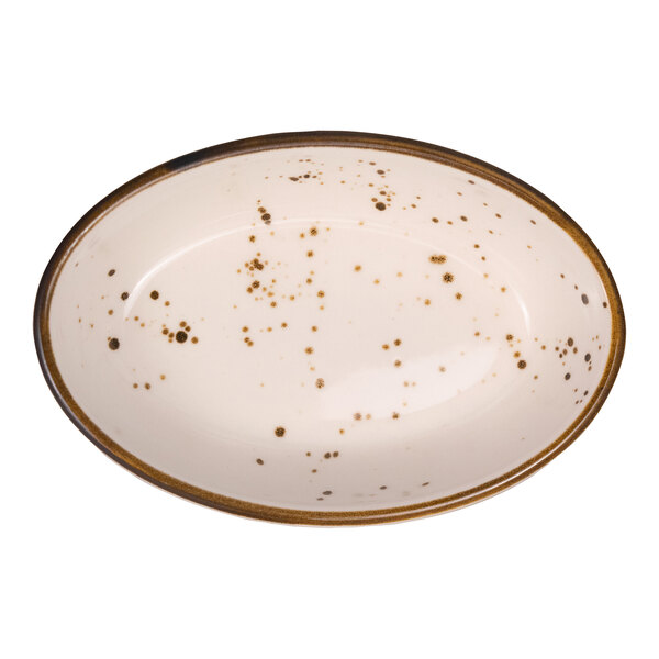 An oval-shaped, cream-colored dish with brown speckles and a brown rim.