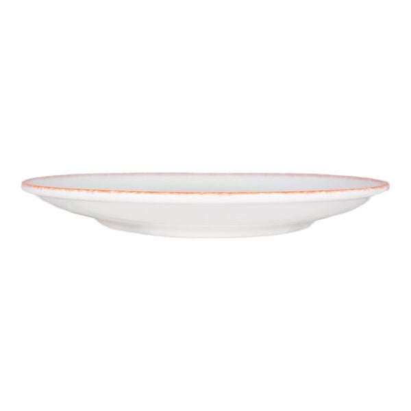 International Tableware Provincial 10" White Porcelain Coupe Plate with Sponged Red Rim - 24/Case