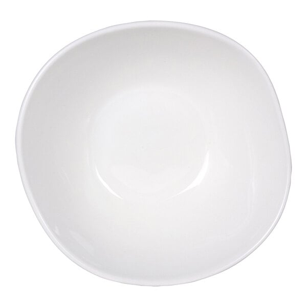 A white, round bowl with a slightly irregular, organic shape viewed from above.