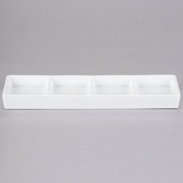 Libbey Chef's Selection II 10 5/8" x 3 1/4" Ultra Bright White Porcelain 4-Well Tray - Sample
