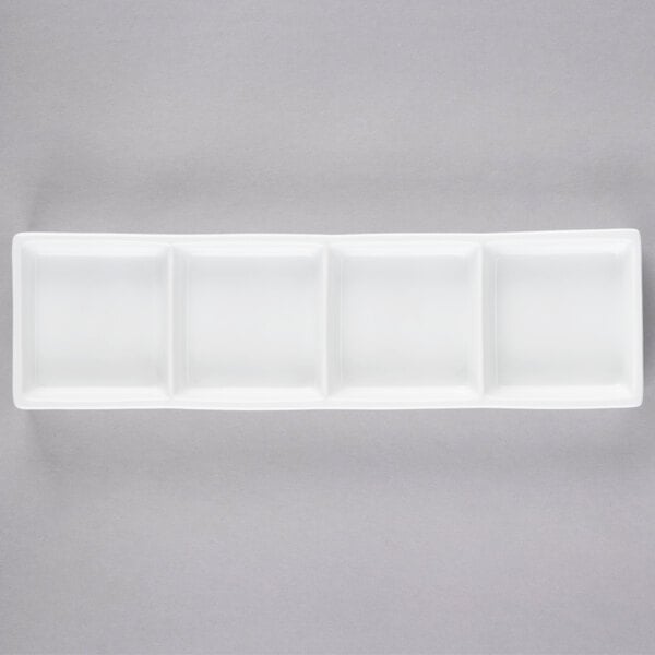 Libbey Chef's Selection II 10 5/8" x 3 1/4" Ultra Bright White Porcelain 4-Well Tray - Sample