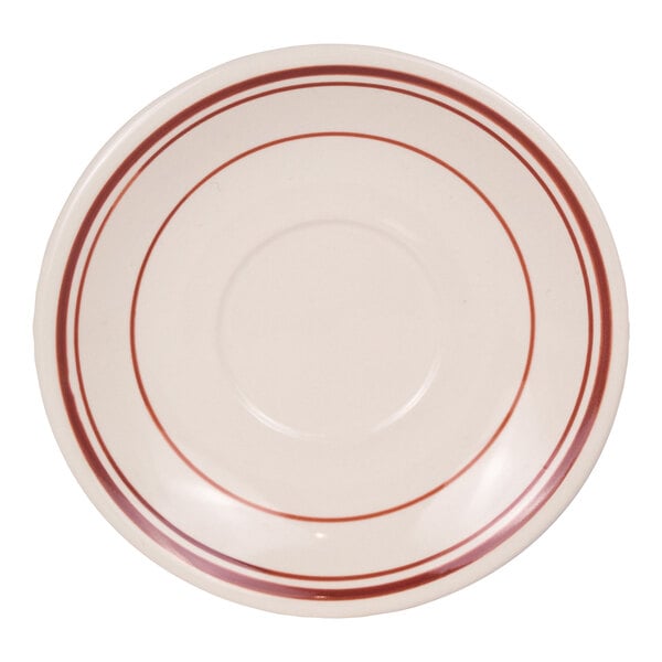 A round, white saucer with two red bands circling the rim and a recessed center.