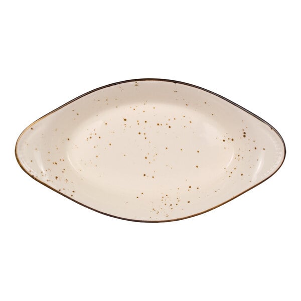 An oval-shaped, cream-colored dish with brown speckles and a slightly raised rim.