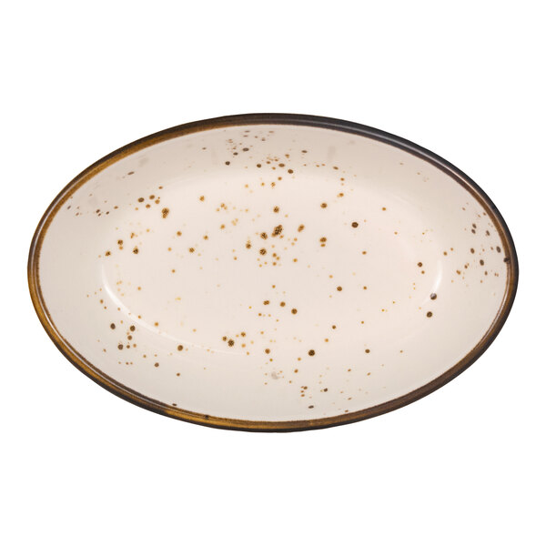 An oval-shaped, cream-colored dish with brown speckles and a dark rim.