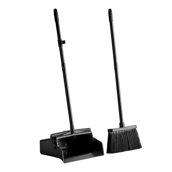 A black dustpan with an open lid and a matching broom, both with long handles, standing upright on a white background.