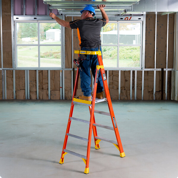 Werner PD6200 Series 10' Orange / Yellow Type IA Fiberglass Podium Ladder PD6204