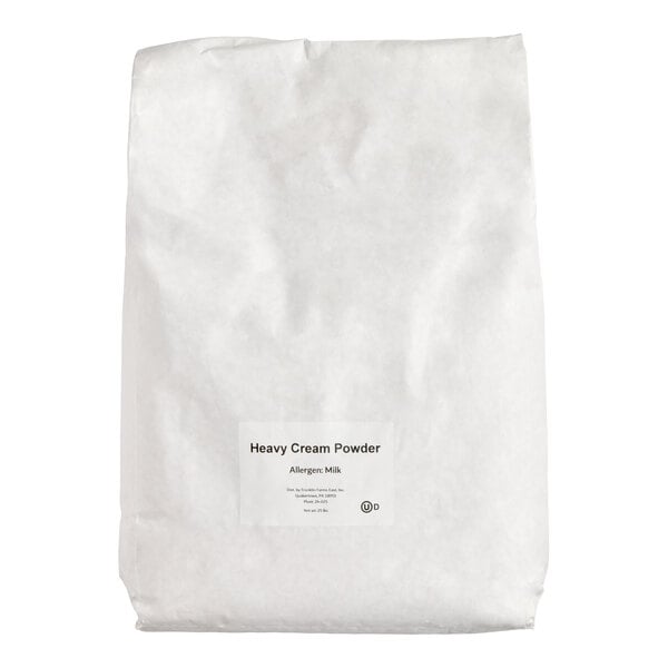 A large white bag with a small label that reads 'Heavy Cream Powder' and 'Allergen: Milk' on the front.
