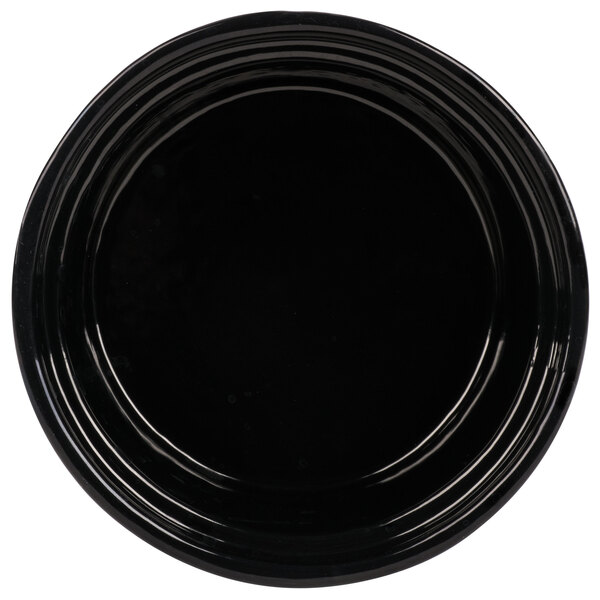 A black Tablecraft cast aluminum souffle bowl with ridges on the rim.