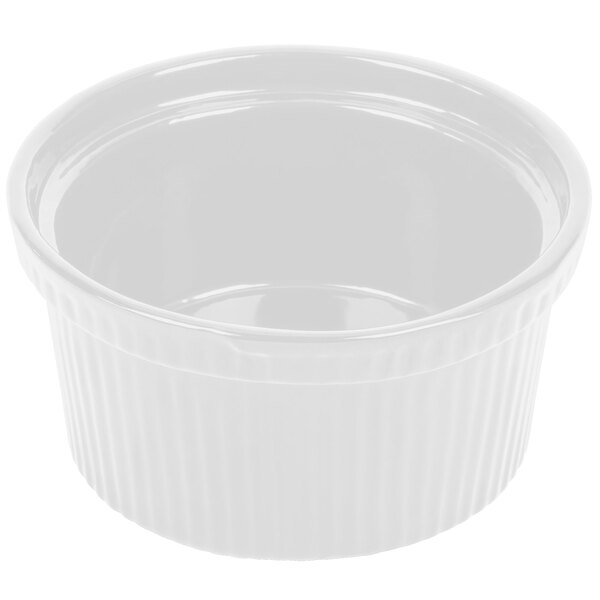 A Tablecraft white cast aluminum souffle bowl with ridges on a white background.