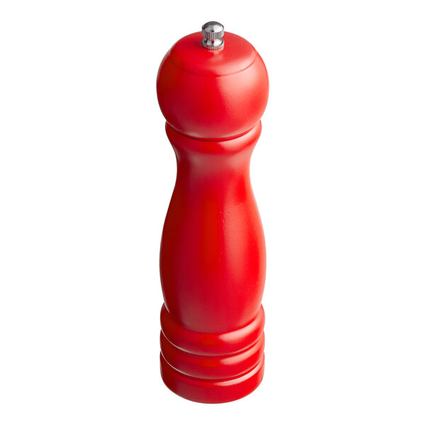 A red, wooden, hand-held mill with a rounded top and a metal knob, designed for grinding salt or pepper.
