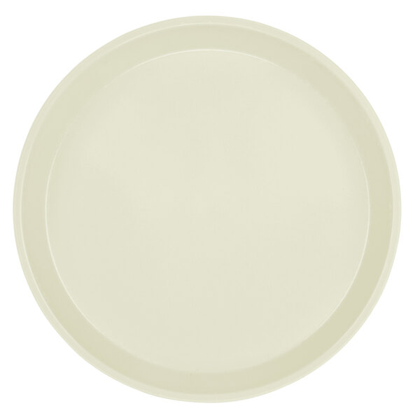 A close-up of a round white Cambro fiberglass tray with a round rim.