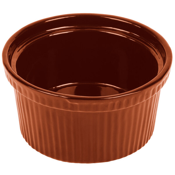 A copper cast aluminum Souffle bowl with ridges.