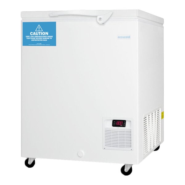A white chest freezer with a digital temperature display, ventilation panel, caution label, and caster wheels.
