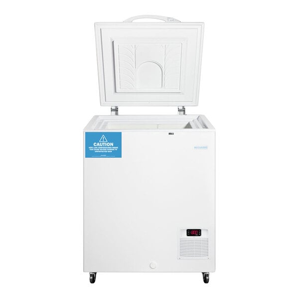 A white chest freezer with an open lid, a digital temperature display, and a caution label on the front.