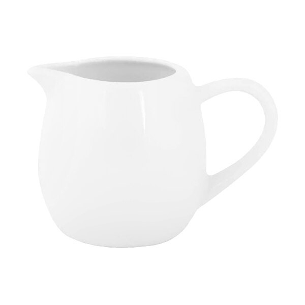 A small white porcelain creamer with a handle and spout, shown against a plain background.