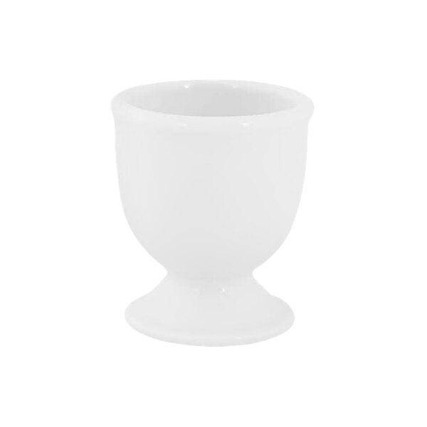 A small, white, footed porcelain cup with a rounded bowl and flared base, photographed against a plain background.