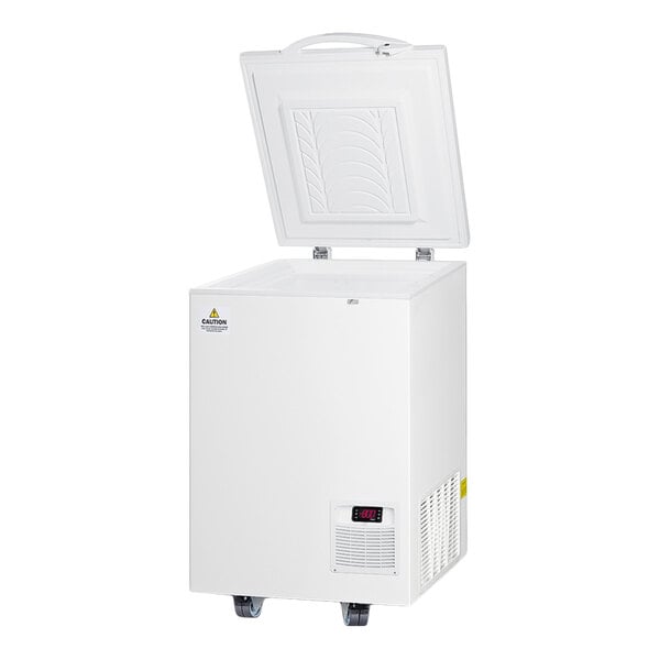 A white chest freezer with an open lid, digital display, and caster wheels.