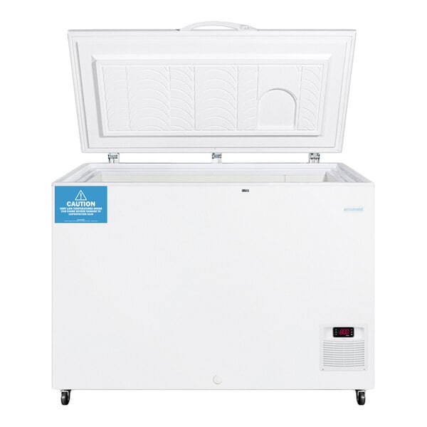 A white chest freezer with an open lid, digital temperature display, and caution label on the front.