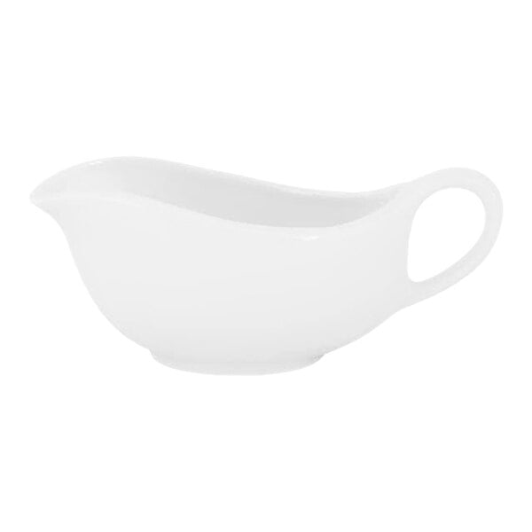 A white porcelain sauce boat with a handle and a spout, shown against a plain background.