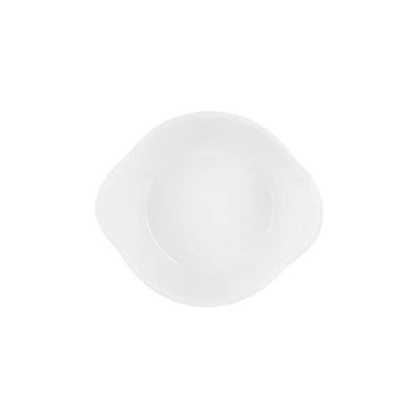 A small, white, round porcelain cup with two slightly extended sides, viewed from above.