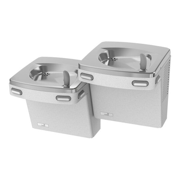 Two wall-mounted, bi-level drinking fountains with a stainless steel finish and grey bases.