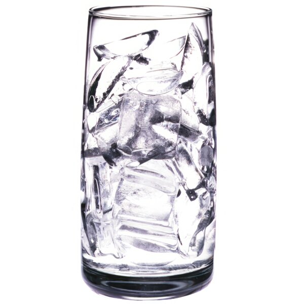 A clear glass filled with crescent-shaped ice cubes.