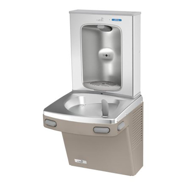 A wall-mounted drinking fountain with a built-in bottle filler, featuring a metallic and beige finish.