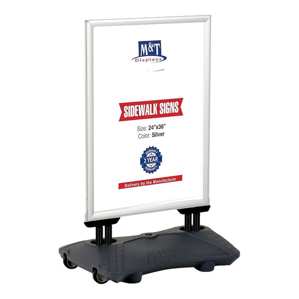 A freestanding sidewalk sign with a silver frame and a gray water-filled base, featuring wheels for mobility.