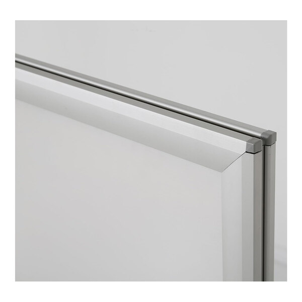A close-up view of a silver-framed panel with a gray trim, likely part of a sign board or display frame.