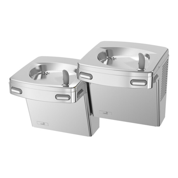 Two stainless steel wall-mounted drinking fountains at different heights, designed for accessibility.